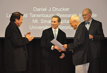 Dr Daniel Drucker is presented with the 2014 Oon International Award